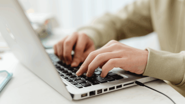 Person typing on a laptop computer